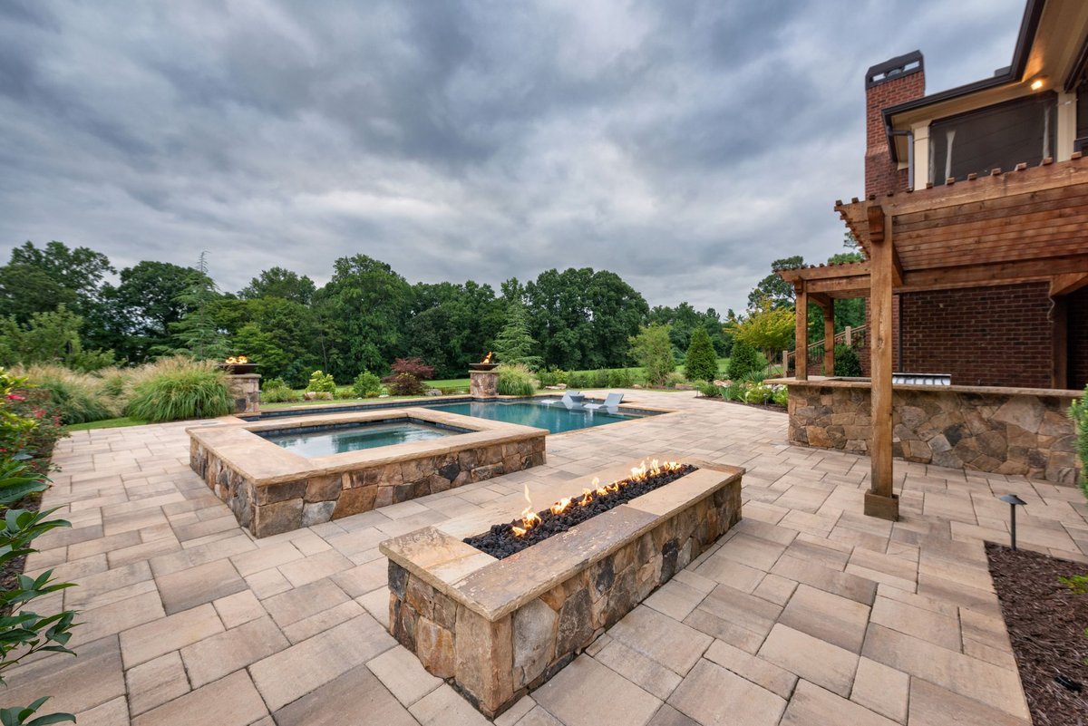 Raised stone spa and linear fire feature on the paver terrace, Traditions of Braselton, Jefferson GA